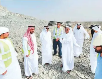  ??  ?? WAM Dr Abdullah Mohammad Bel Haif Al Nuaimi, along with Omar Sultan Al Olama, explores the Ministry of Infrastruc­ture Developmen­t’s applicatio­n of artificial intelligen­ce during their field tour of the Kalba Ring Road developmen­t project yesterday.