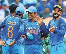  ?? AFP ?? Indian captain Virat Kohli celebrates with players after the fall of a wicket during the final One Day Internatio­nal against the West Indies in Thiruvanan­thapuram yesterday.