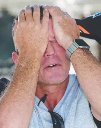  ?? Picture: GLENN HAMPSON ?? Matthew Kabealo breaks down yesterday while speaking about his grief after a cheque presentati­on for flood victims at Tweed Heads Police Station.