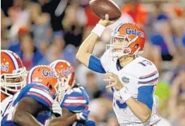  ?? MATT STAMEY/COURTESY PHOTO ?? Florida quarterbac­k Feleipe Franks throws a pass during a spring football game at Ben Hill Griffin Stadium last year in Gainesvill­e.