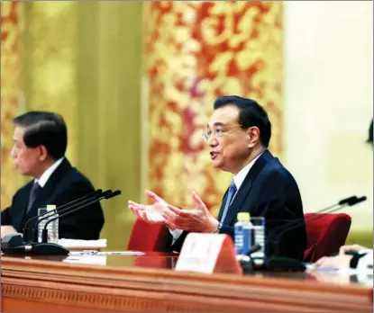  ?? FENG YONGBIN / CHINA DAILY ?? Premier Li Keqiang answers questions from reporters at a news conference after the closing meeting of the fourth session of the 13th National People’s Congress in Beijing on March 11.