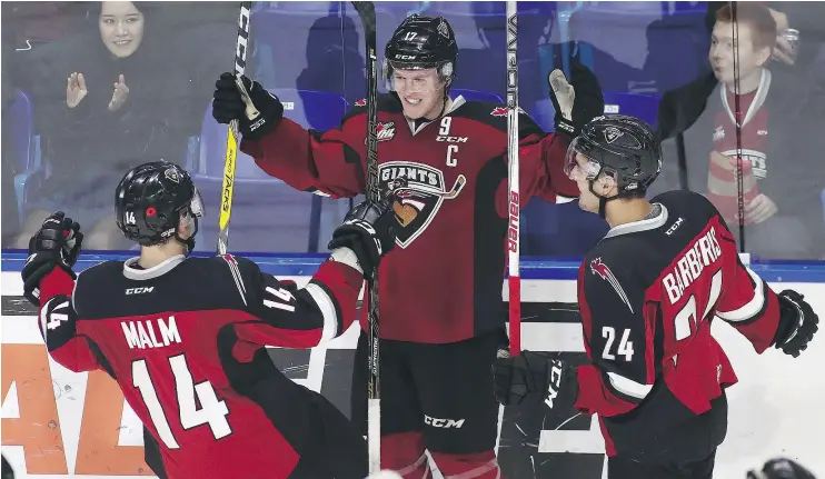  ?? — GETTY IMAGES FILES ?? Giants captain Tyler Benson, centre, celebrates after scoring against the Lethbridge Hurricanes last week. He’s currently on a five-game points streak.