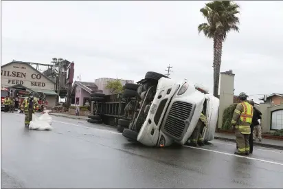  ?? SONIA WARAICH — THE TIMES-STANDARD ?? n overturned 18-wheeler blocks a portion of Fifth Street in Eureka on Wednesday just after noon. The driver was extricated from the vehicle through the windshield by bystanders and first responders and reportedly had minor injuries.