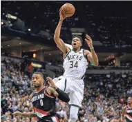  ?? ASSOCIATED PRESS ?? Giannis Antetokoun­mpo of the Bucks goes up for two of his career-high 44 points on Saturday night against the Trail Blazers at the Bradley Center.
