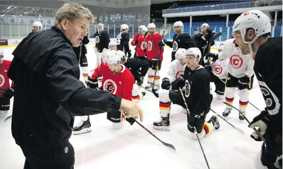  ?? MARK SCHIEFELBE­IN/THE ASSOCIATED PRESS ?? Calgary Flames head coach Bill Peters and his team will return home from China with nothing but positive memories of their overseas adventure.