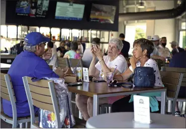  ?? THE ASSOCIATED PRESS ?? Baseball fans gather in the Bullpen Club at George M. Steinbrenn­er Field before a spring training exhibition baseball game between the New York Yankees and the Toronto Blue Jays in Tampa, Fla.