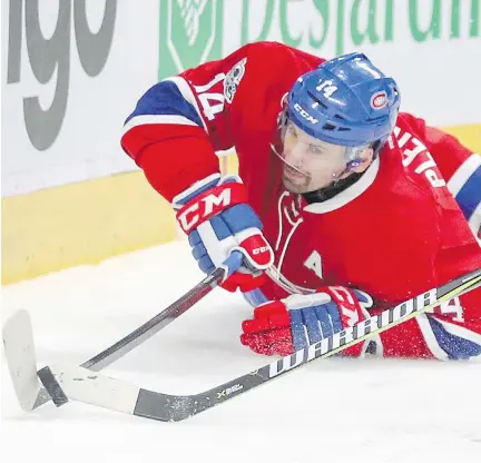  ?? JOHN MAHONEY ?? Centre Tomas Plekanec plays the puck while falling to the ice Saturday against the Caps. Plekanec has one goal in his last 11 games.