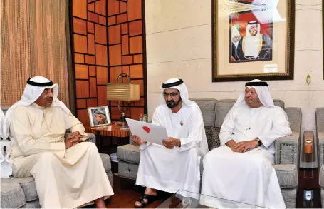  ?? Wam ?? Sheikh Mohammed bin Rashid, Vice President and Ruler of Dubai, with Dr Anwar Gargash, Minister of State for Foreign Affairs, accepts a letter of mediation from Kuwait’s foreign minister Sheikh Sabah Al Khaled