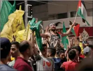  ??  ?? Palestinia­ns celebratin­g cease-fire in Gaza City