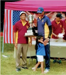  ??  ?? Ruchira Jayasuriya, captain of the Royal team receiving the Olcott Trophy from Athula Seneviratn­e.