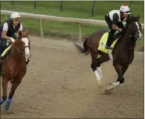  ?? CHARLIE RIEDEL - THE ASSOCIATED PRESS ?? Kentucky Derby entrants Improbable, left, and War of Will run during a workout at Churchill Downs Wednesday, May 1, 2019, in Louisville, Ky.