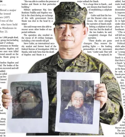  ??  ?? Philippine military chief General Eduardo Año shows images of Islamic militant leaders Isnilon Hapilon, right, and Omarkhayam Maute, left, during a press conference at a military camp in Marawi on the southern island of Mindanao on Monday. (AFP)