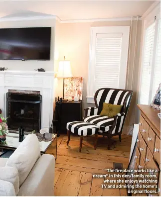  ??  ?? “The fireplace works like a dream” in this den/family room, where she enjoys watching TV and admiring the home’s
original floors.