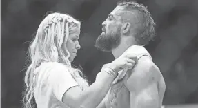  ?? BRUCE FEDYCK/USA TODAY SPORTS ?? Danielle Nickerson helps Mike Perry in December 2017 at UFC Fight Night.