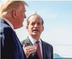  ??  ?? Labor Secretary Alex Acosta announces his resignatio­n Friday with President Donald Trump at his side.