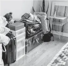  ?? Photos by Jeenah Moon/new York Times ?? Molly Parker Wade stacks belongings carefully at her home in Brooklyn, N.Y. Rates fell to 6.09%, according to Freddie Mac.