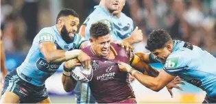  ??  ?? Queensland winger Dane Gagai under siege from Josh Addo-Carr (left) and Latrell Mitchell.