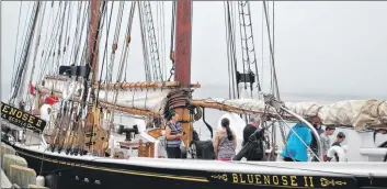  ??  ?? People explore the deck of Bluenose II during the visit to Dennis Point wharf. People were able to do the same when the vessel visited Shelburne.