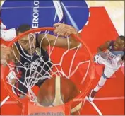  ?? Lintao Zhang AFP/Getty Images ?? RUDY GOBERT of France dunks during an 89-79 World Cup quarterfin­al victory over the U.S.