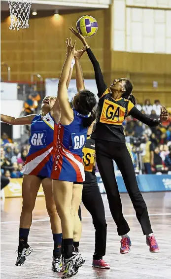  ??  ?? Get outta my way: Malaysia’s L. Karishma (right) stretching for the ball during the match against the Philippine­s at Stadium Juara in Bukit Kiara yesterday. — Bernama