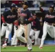  ?? DAVID DERMER — ASSOCIATED PRESS ?? Jose Ramirez scores on a double by Jay Bruce during the Indians’ 22nd straight win Sept. 14.