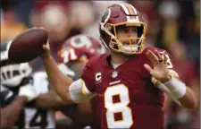  ??  ?? Washington Redskins quarterbac­k Kirk Cousins passes against the Los Angeles Rams during the first half of an NFL football game Sunday in Los Angeles. AP PHOTO/KELVIN KUO