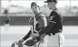  ?? K.C. ALFRED U-T ?? Padres catcher Austin Nola (left) hit and did catching drills Wednesday.