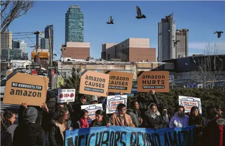  ?? Drew Angerer / Getty Images ?? Activists and community members who opposed Amazon’s plan to move to Long Island City in the Queens borough of New York City rally in celebratio­n of the company’s decision to pull out of the deal. Amazon had said the deal would create over 25,000 jobs.