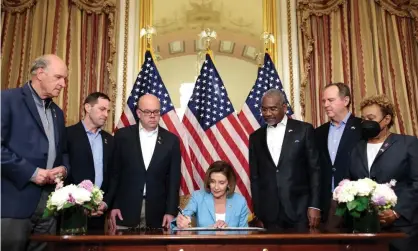  ?? Photograph: Anna Moneymaker/Getty Images ?? Nancy Pelosi signs the Ukraine Democracy Defence Lend-Lease Act of 2022 at the Capitol building in Washington DC, 2 May 2022.