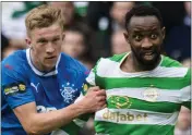  ??  ?? Moussa Dembele is fouled by Ross McCrorie