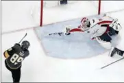  ?? JOHN LOCHER — THE ASSOCIATED PRESS ?? Washington Capitals goaltender Braden Holtby, right, makes a stick save on shot by Vegas Golden Knights right wing Alex Tuch during the third period in Game 2 of the NHL hockey Stanley Cup Finals on Wednesday in Las Vegas.