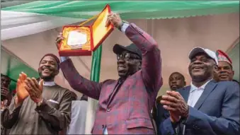  ??  ?? L-R: Minister of State for Education, Barr Chukwuemek­a Nwajiuba and Edo State Governor, Mr. Godwin Obaseki, and permanent secretary, Federal Ministry of Education, Mr. Sonny Echono during the World Teacher's Day celebratio­n, where Governor Obaseki was honoured as the 2019 NUT Best Performing Governor, in Abuja