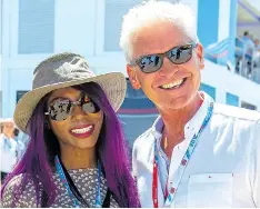  ??  ?? Singer Sinitta and TV host Phillip Schofield wearing shades