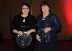  ?? NWA Democrat-Gazette/CARIN SCHOPPMEYE­R ?? Carrie Harlow (left) and her mother Sandy Michael are awarded the 2017 Hunger Heroes Award at the Jewels of Giving Gala to benefit the Northwest Arkasnsas Food Bank.