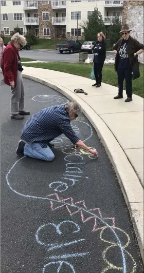 ?? COURTESY OF THE HERITAGE OF GREEN HILLS ?? Residents of the Heritage of Green Hills use sidewalk chalk to write encouragin­g messages to staff and neighbors. Cheryl Anderson, activities director at the senior living facility in Cumru Township, Berks County, is coming up with creative ways to engage residents during the COVID-19pandemic.