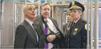  ?? | SUN- TIMES FILE PHOTO ?? Mayor Rahm Emanuel, then- CTA President Forrest Claypool, Ald. Deb Mell ( 33rd) and Police Cmdr. Nancy Lipman look over safety features on a CTA rail car in 2014.