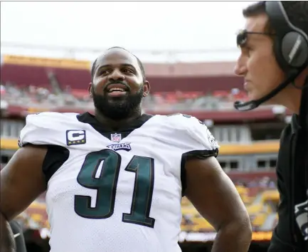  ?? MARK TENALLY — THE ASSOCIATED PRESS ?? Philadelph­ia Eagles defensive tackle Fletcher Cox, left, a six-time Pro Bowler, was placed on the team’s Covid-19reserve list Monday.