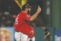  ?? The Associated Press ?? RANGER CELEBRATIO­N: Texas Rangers’ Lance Lynn celebrates after getting Los Angeles Angels’ Shohei Ohtani to fly out to end the top of the seventh inning of Thursday’s game in Arlington, Texas.
