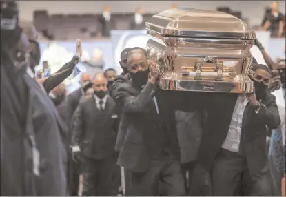  ?? GODOFREDO A. VÁSQUEZ/The Associated Press ?? Pallbearer­s recess out of the church with the casket following the funeral for George Floyd on Tuesday, June 9, 2020, at The Fountain of Praise church in Houston.