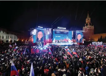  ?? — AFP photo ?? Putin addressing the crowd during a rally at Red Square in Moscow.