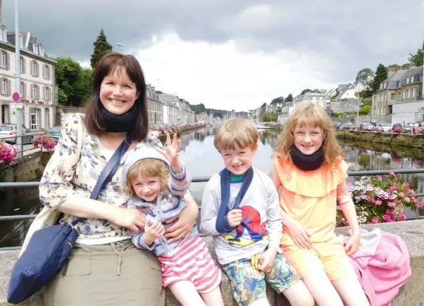  ??  ?? THANKFUL: Louise with her children and, right, the wreck of the Honda, written off just 20 minutes after the family drove off the ferry at the beginning of their French adventure