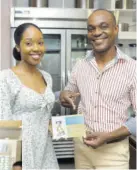  ?? ?? Sagicor Bank Marketing Officer Jhanel Williams presented a gift certificat­e valued at $10,000 to client Odean Skeen towards opening a Sagicor Bank Star Savers account for his child.