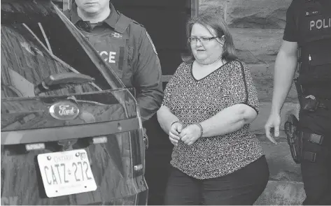  ?? MORRIS LAMONT/THE LONDON FREE PRESS ?? Elizabeth Wettlaufer, the former seniors’ home nurse who was convicted in the murder of eight elderly people under her care in Woodstock, Ont., leaves the Oxford County Court House after being sentenced to life in prison on Monday.