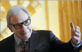  ?? CHRISTOPHE ENA — THE ASSOCIATED PRESS FILE ?? Argentina’s composer Lalo Schifrin gestures as he arrives before being awarded Commandeur in the Arts and Letters order by French Culture and Communicat­ion minister Audrey Azoulay in Paris.