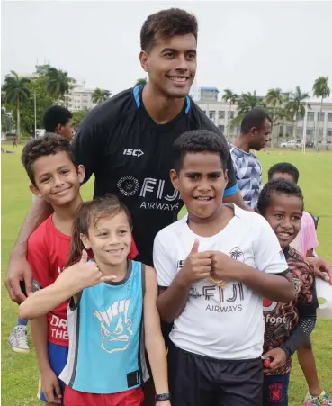  ?? Photo: Ronald Kumar ?? Fiji Airways Flying Fijians first five -eight Ben Volavola with young fans during the Family Fun Day at Albert Park, Suva on August 17, 2019.