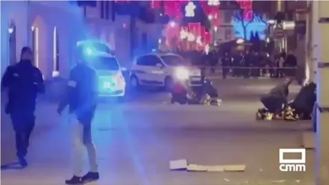  ??  ?? In this image made from video provided by CMM, people lay on the ground after a shooting at a Christmas market in Strasbourg, France, Tuesday, Dec. 11, 2018. A French regional official says that a shooting in Strasbourg has left at least one dead and several wounded in the city center near a world-famous Christmas market. The prefect of France’s Bas-Rhin region says the gunman, who is still at large, has been identified. Authoritie­s haven’t given a motive for the shooting. (CMM via AP)