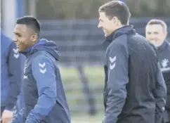  ??  ?? 0 Morelos and Gerrard share a joke in training yesterday.