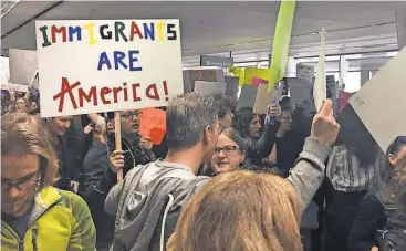  ?? JON SWARTZ, USA TODAY ?? Protesters object to President Trump’s order on immigratio­n at the San Francisco Internatio­nal Airport on Sunday. Silicon Valley firms swiftly denounced the ban.