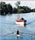  ??  ?? A rower and pleasure craft on the Thames near Maidenhead Bridge, Berkshire