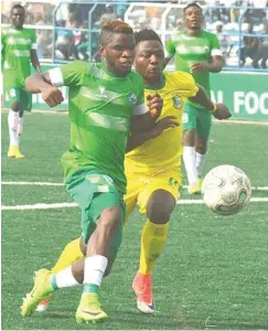  ??  ?? Kano Pillars player vies with his Nasarawa United opponent during a league match